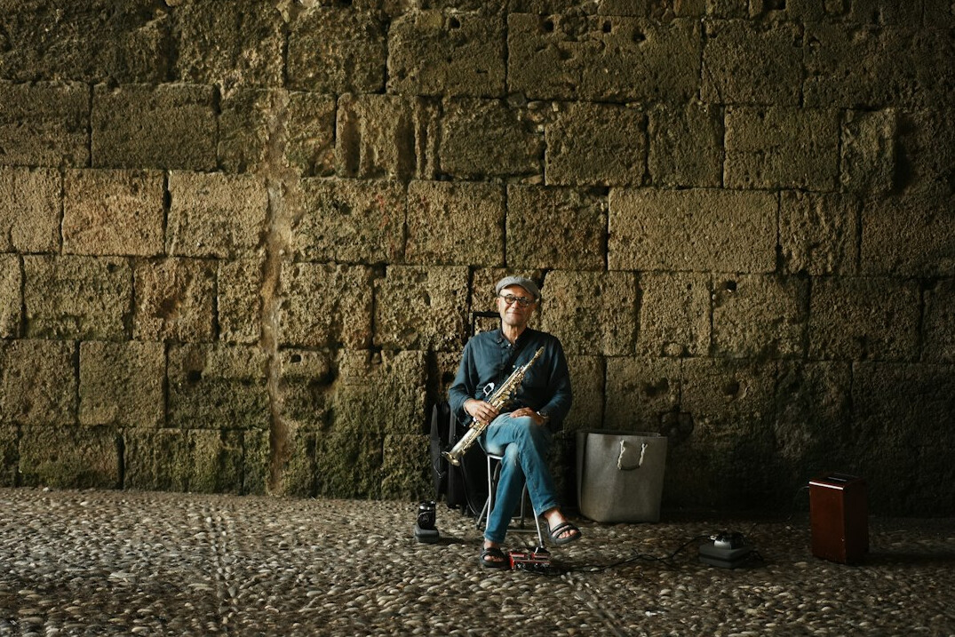Portrait of a European male musician with a guitar