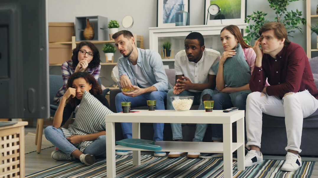 group watching old tv