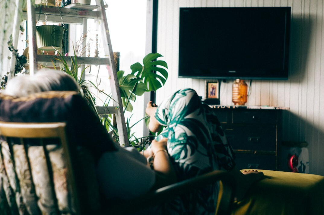 person binge watching tv